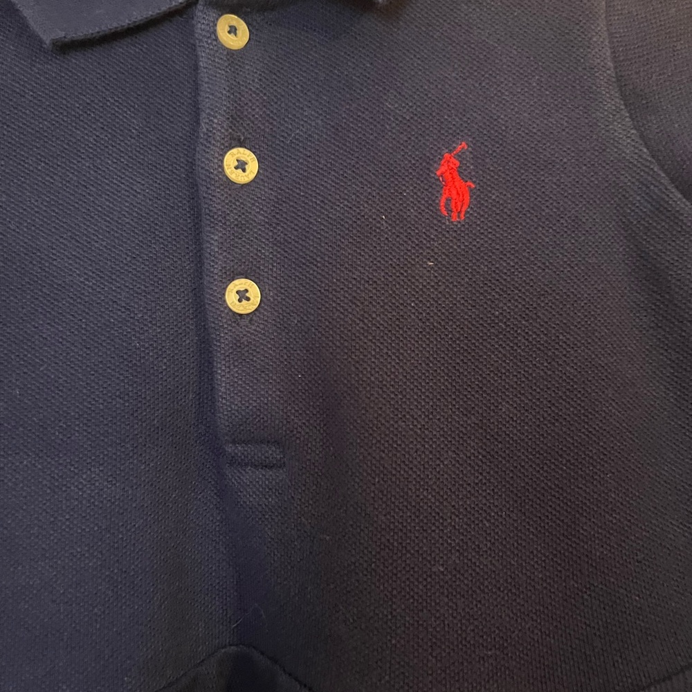 Ralph Lauren Infant Navy Polo Shirt with Peplum design.